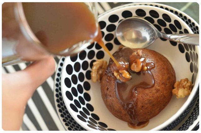 Pouring toffee sauce on sticky date pudding
